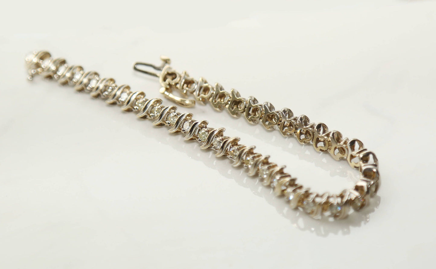 Vintage 14k gold diamond tennis bracelet
