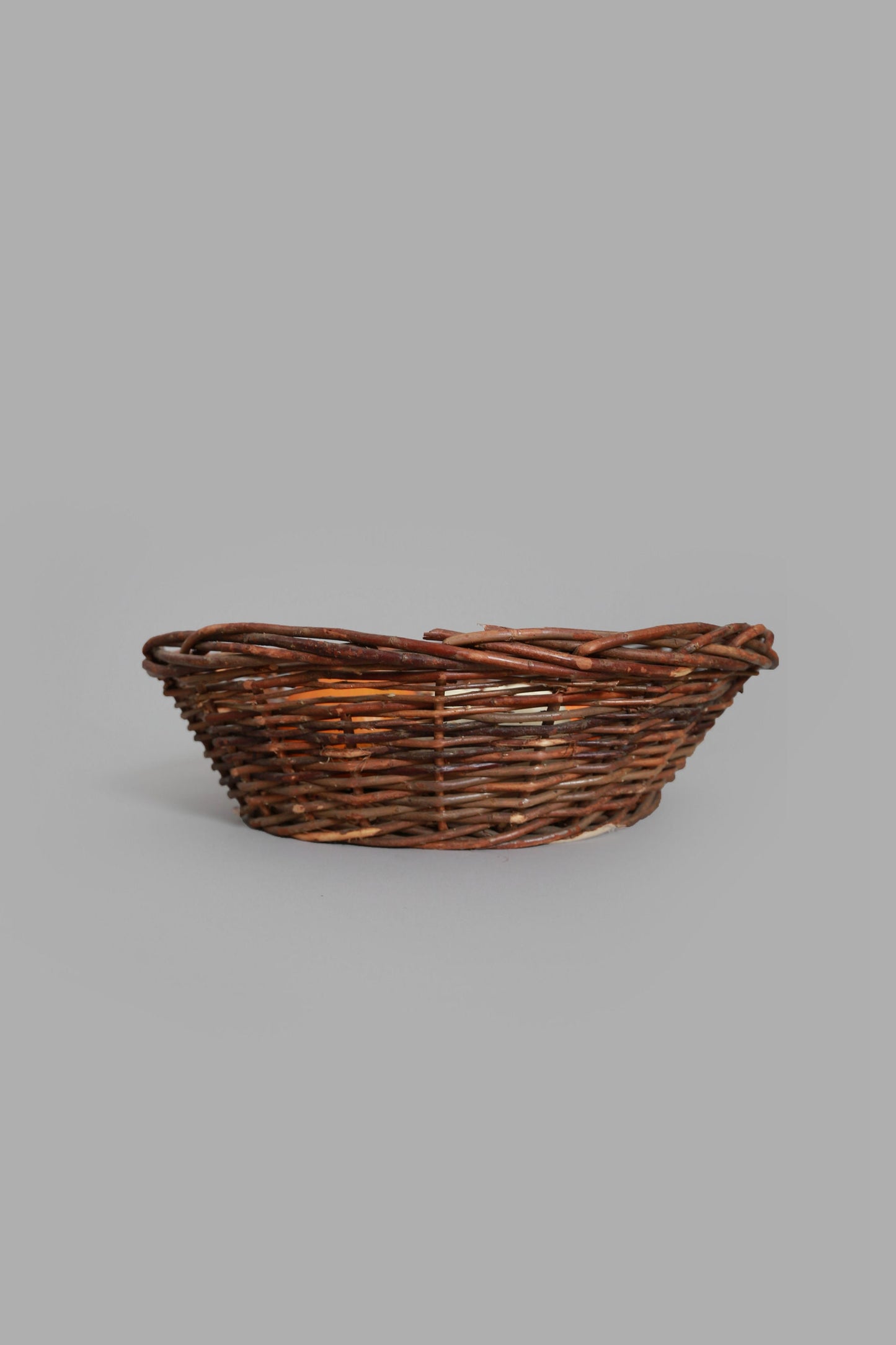 Vintage woven grape vine twig harvest basket