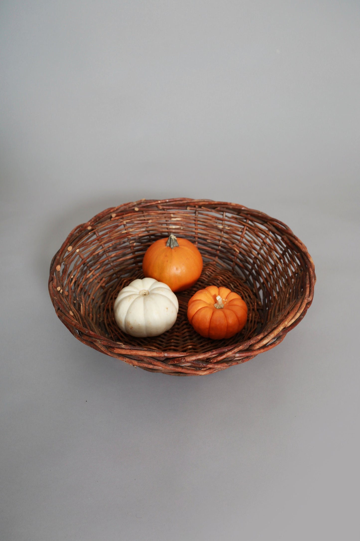 Vintage woven grape vine twig harvest basket