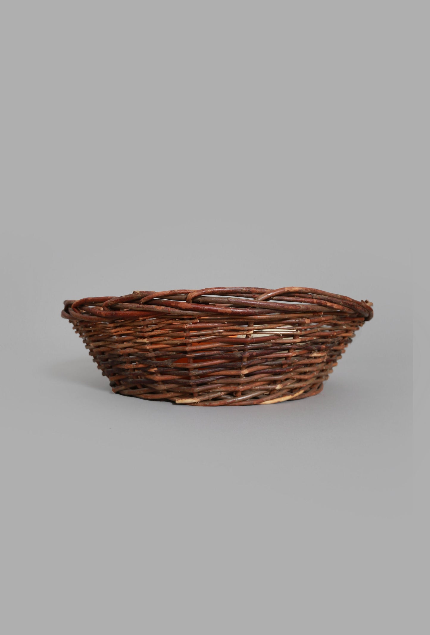 Vintage woven grape vine twig harvest basket